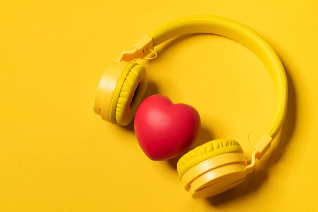 Yellow Headphones On Yellow Background And A Heart